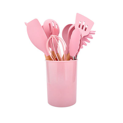 Le silicone antiadhésif faisant cuire l'ustensile de couleur a placé la trousse d'outils de cuisine